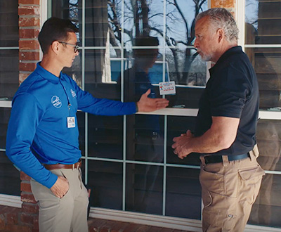Windows USA sales representative meeting with a homeowner